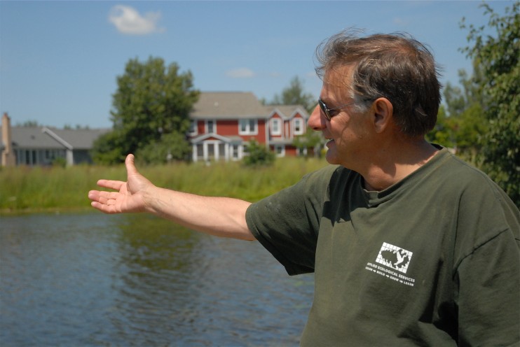 Steve Apfelbaum shows us the lake at Prairie Crossing where the water has been filtered by the native landscape and is pure enough to swim in