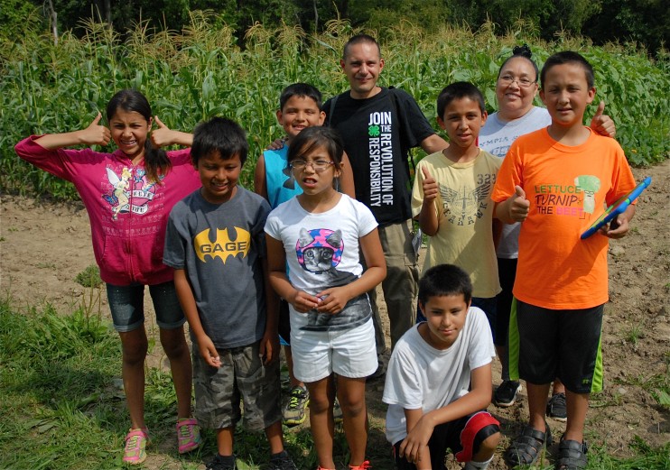 Seneca students learn about native plants including growing and harvesting the traditional Three Sisters natives, corn, beans and squash.
